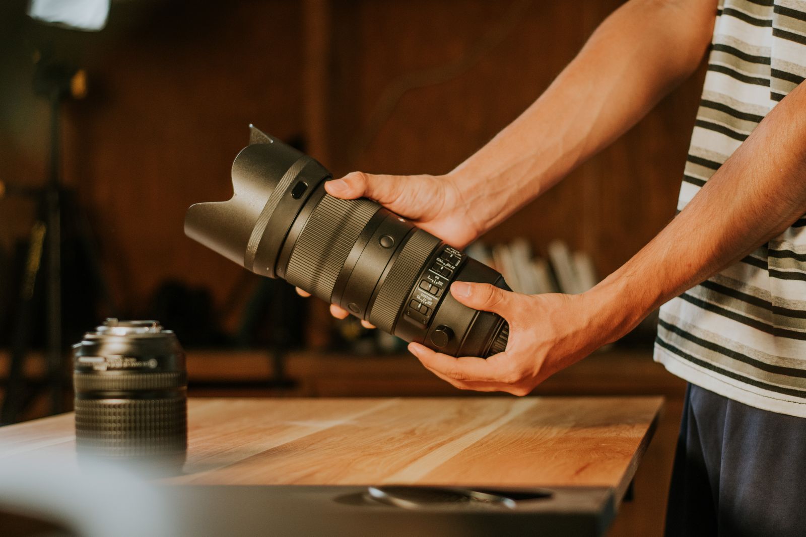 Hands holding a camera during a production shoot